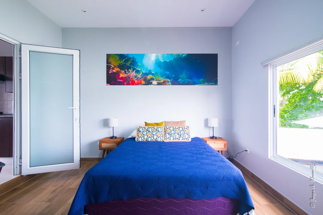 Corals Playa Blanca · bed with blue linens